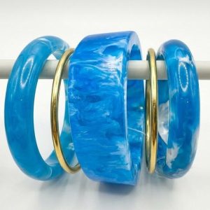 resin and brass bangles set with multiple colours and designs